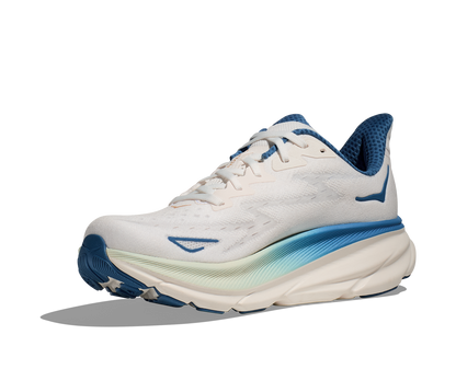 Hoka M Clifton 9 FTG - Vit med blåa och guld detaljer.